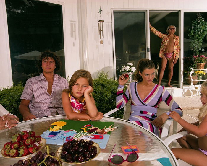 Family sitting at patio table