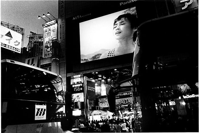 Busy Japanese street with woman on advertisement