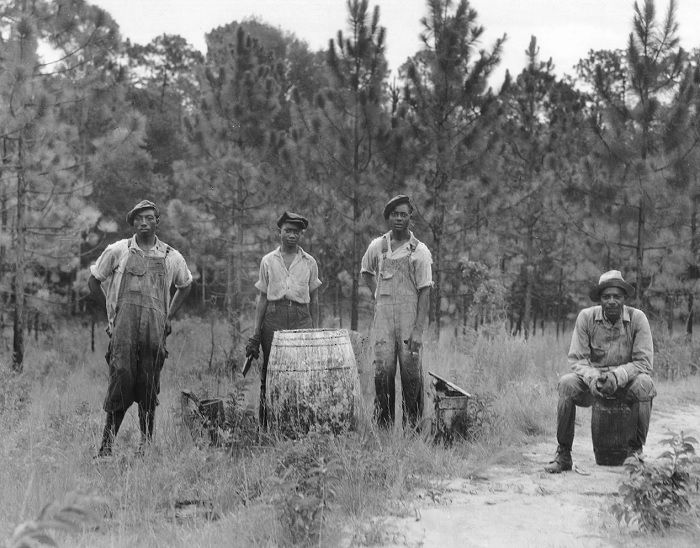 Four black field workers