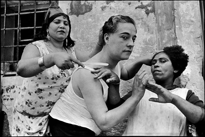 Three people brushing hair