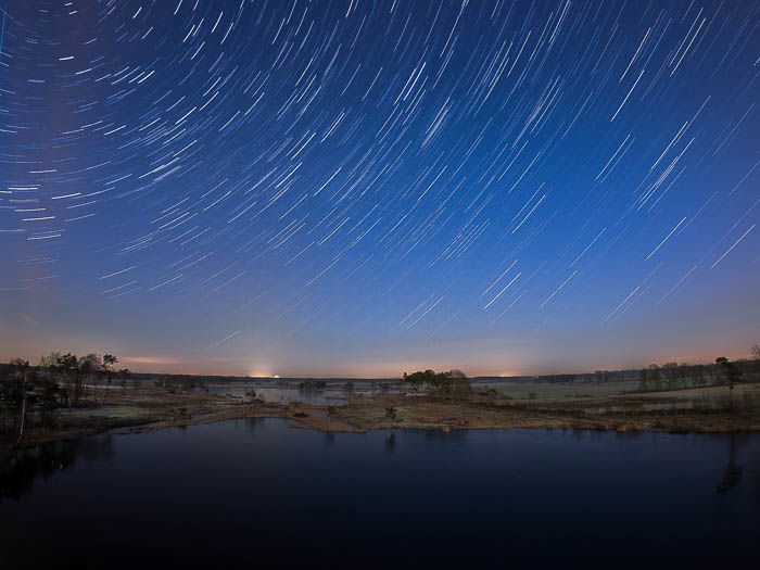 star trail over Belgian marsh field