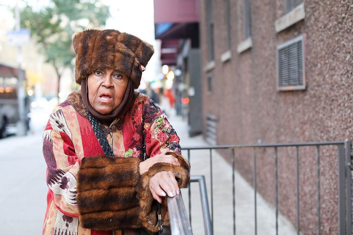 Street portrait of a woman in a fur hat