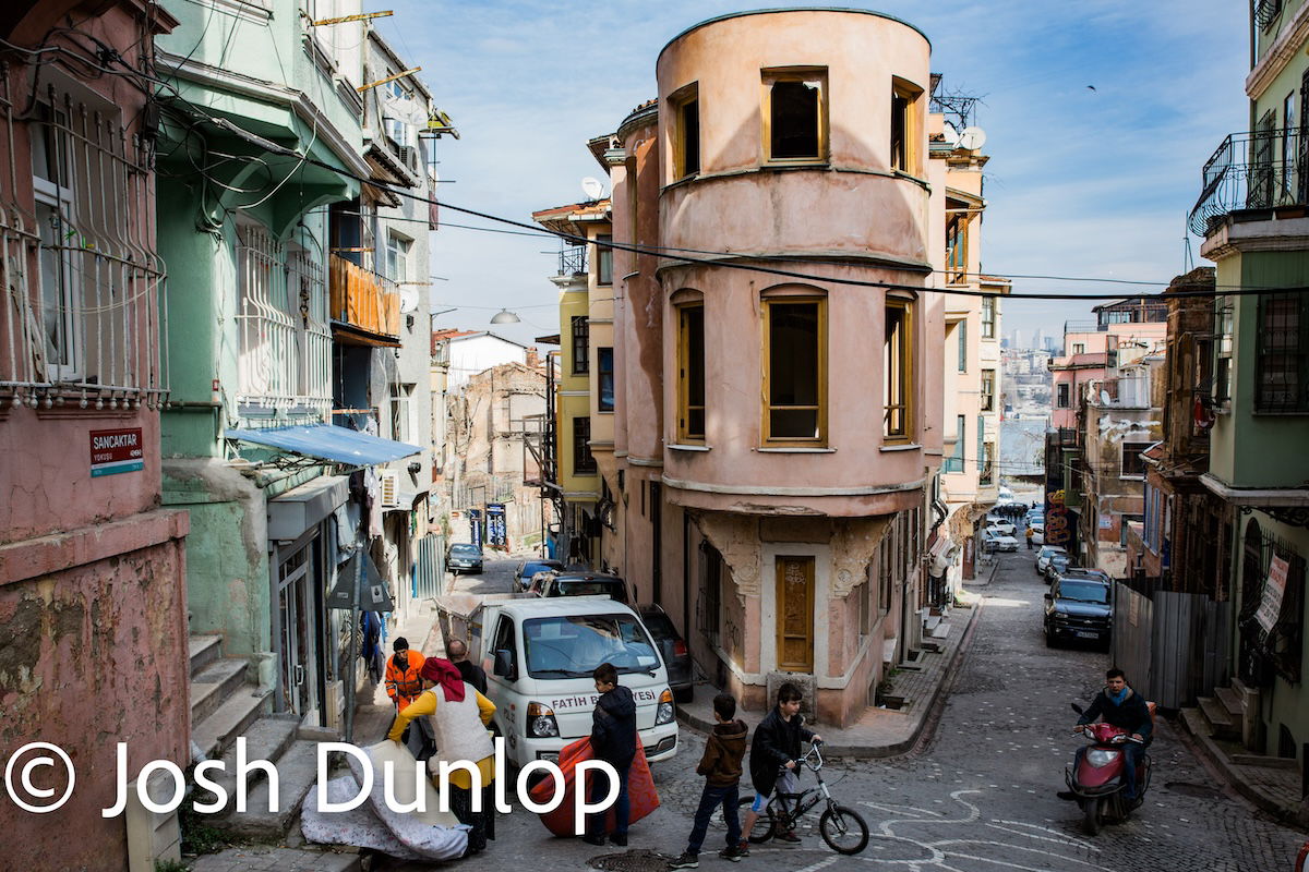 image of a street with boy playing